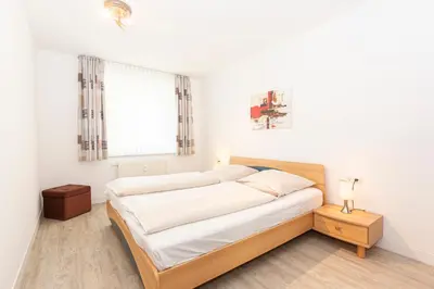 Ein Bett oder Betten in einem Zimmer der Unterkunft Kurpark-Residenz 133
