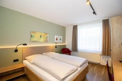 Ein Bett oder Betten in einem Zimmer der Unterkunft Kurpark-Residenz 117