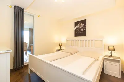 Ein Bett oder Betten in einem Zimmer der Unterkunft Kurpark-Residenz 144