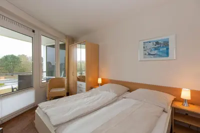 Ein Bett oder Betten in einem Zimmer der Unterkunft Kurpark-Residenz 119