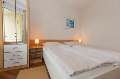 Ein Bett oder Betten in einem Zimmer der Unterkunft Kurpark-Residenz 119