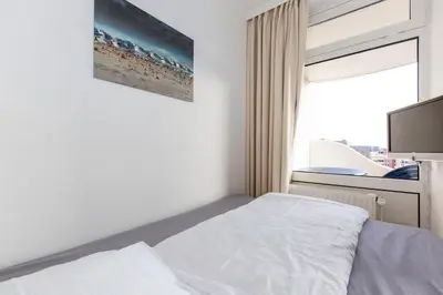 Ein Bett oder Betten in einem Zimmer der Unterkunft Lord Nelson 413
