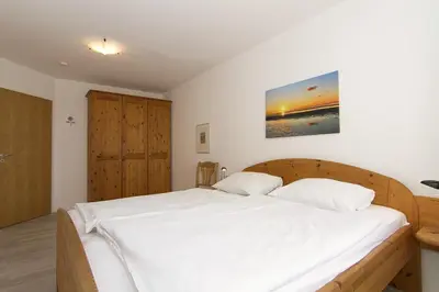 Ein Bett oder Betten in einem Zimmer der Unterkunft Kurpark-Residenz 134
