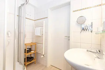 Ein Badezimmer in der Unterkunft Kurpark-Residenz 143