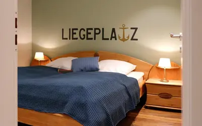 Ein Bett oder Betten in einem Zimmer der Unterkunft Kurpark-Residenz 114