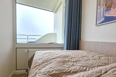 Ein Bett oder Betten in einem Zimmer der Unterkunft Lord Nelson 803