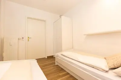 Ein Bett oder Betten in einem Zimmer der Unterkunft Kurpark-Residenz 235