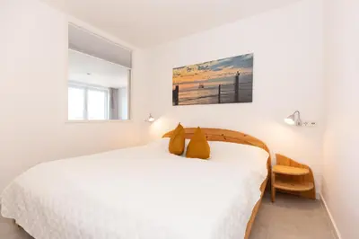 Ein Bett oder Betten in einem Zimmer der Unterkunft Kurpark-Residenz 139