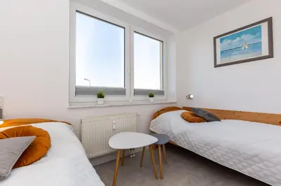 Ein Bett oder Betten in einem Zimmer der Unterkunft Kurpark-Residenz 139