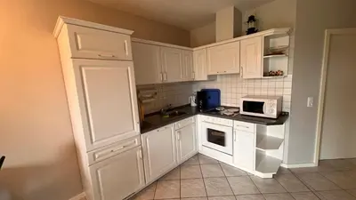 Küche/Küchenzeile in der Unterkunft Ferienwohnung am Kormoranweg