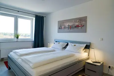 Ein Bett oder Betten in einem Zimmer der Unterkunft Haus Nordseebrandung NC61