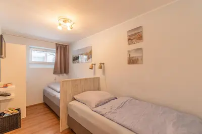 Ein Bett oder Betten in einem Zimmer der Unterkunft Haus Knechtsand, Whg 415