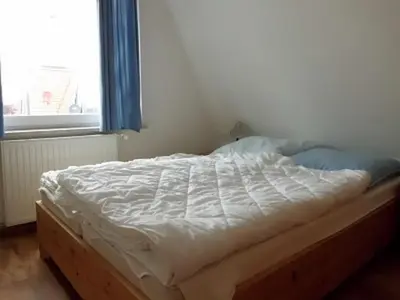 Ein Bett oder Betten in einem Zimmer der Unterkunft Nordsee