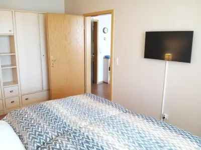 Ein Bett oder Betten in einem Zimmer der Unterkunft Kurpark-Residenz 206