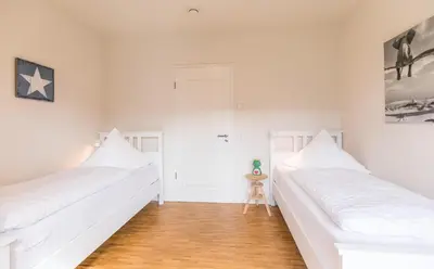 Ein Bett oder Betten in einem Zimmer der Unterkunft Kirchenstr 22 Bi de Kark