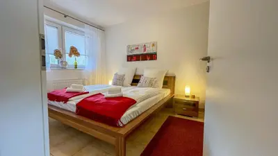 Ein Bett oder Betten in einem Zimmer der Unterkunft Apartmenthaus Waldbad WHG Westwind 15 4