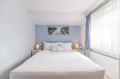 Ein Bett oder Betten in einem Zimmer der Unterkunft 