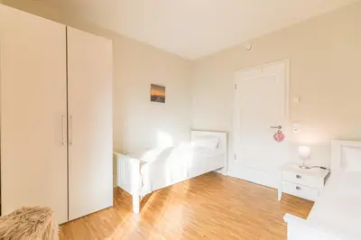 Ein Bett oder Betten in einem Zimmer der Unterkunft Kirchenstr 22 Nordlichter