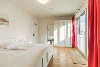 Ein Bett oder Betten in einem Zimmer der Unterkunft Kirchenstr 22 Nordlichter