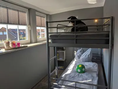 Ein Bett oder Betten in einem Zimmer der Unterkunft Nordseelig Ferienhäuser 6 Pers 2018 saniert Hunde erlaubt