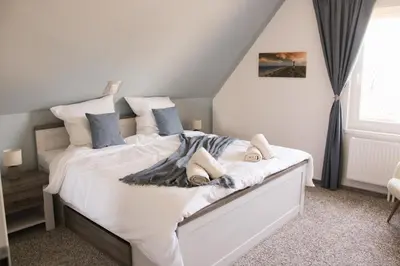 Ein Bett oder Betten in einem Zimmer der Unterkunft Maricas Meereszeiten Wellness