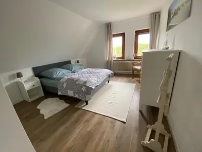 Ein Bett oder Betten in einem Zimmer der Unterkunft Hus am Diek