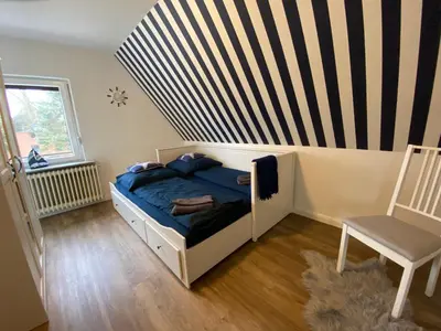 Ein Bett oder Betten in einem Zimmer der Unterkunft Hus am Diek