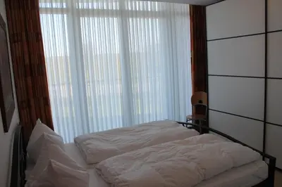Ein Bett oder Betten in einem Zimmer der Unterkunft Nordseeblick 6