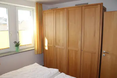 Ein Bett oder Betten in einem Zimmer der Unterkunft Nordseeblick 6