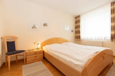 Ein Bett oder Betten in einem Zimmer der Unterkunft Kurpark-Residenz 209