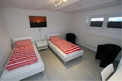 Ein Bett oder Betten in einem Zimmer der Unterkunft Strand-Villa, Nige Ooge