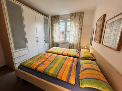 Ein Bett oder Betten in einem Zimmer der Unterkunft Dünenwind, Ferienwohnung 3