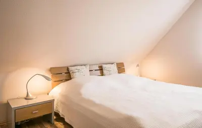 Ein Bett oder Betten in einem Zimmer der Unterkunft Domizil am Hafen Domizil am Hafen, Whg Ricarda