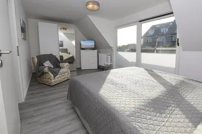 Ein Bett oder Betten in einem Zimmer der Unterkunft Haus im Törn Haus im Törn, Whg 1
