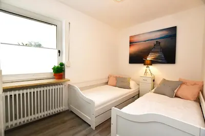 Ein Bett oder Betten in einem Zimmer der Unterkunft Haus im Törn Haus im Törn, Whg 2