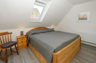 Ein Bett oder Betten in einem Zimmer der Unterkunft Haus im Törn Haus im Törn, Whg 3