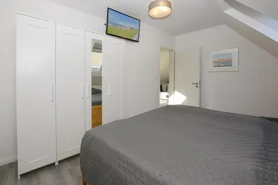 Ein Bett oder Betten in einem Zimmer der Unterkunft Haus im Törn Haus im Törn, Whg 3
