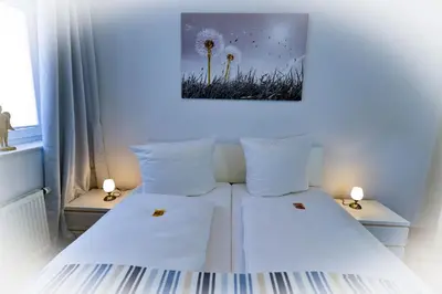 Ein Bett oder Betten in einem Zimmer der Unterkunft Haus am Waldbad AW12