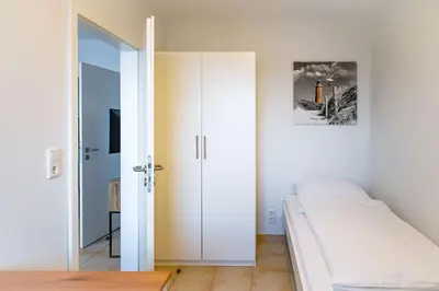 Ein Bett oder Betten in einem Zimmer der Unterkunft Haus am Waldbad AW12