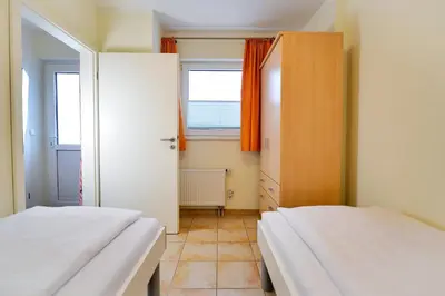 Ein Bett oder Betten in einem Zimmer der Unterkunft Haus am Waldbad AW25