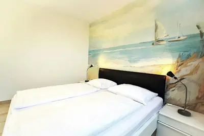 Ein Bett oder Betten in einem Zimmer der Unterkunft Haus am Waldbad AW25