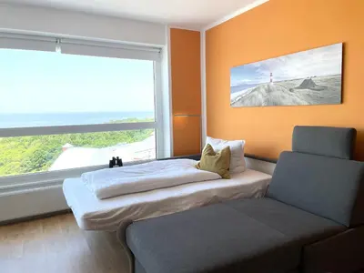 Ein Bett oder Betten in einem Zimmer der Unterkunft Frische Brise FeWo12 09
