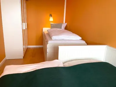 Ein Bett oder Betten in einem Zimmer der Unterkunft Frische Brise FeWo12 09