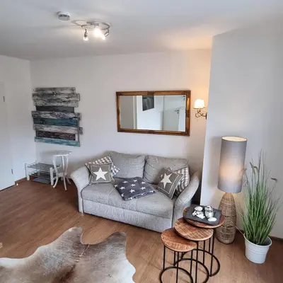 Ein Sitzbereich in der Unterkunft Haus Kaiser Appartement 4 Deichsommer