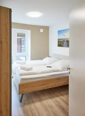 Ein Bett oder Betten in einem Zimmer der Unterkunft Nordseestern