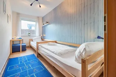 Ein Bett oder Betten in einem Zimmer der Unterkunft Duhner Brise - 10