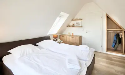 Ein Bett oder Betten in einem Zimmer der Unterkunft Strandburg - 12