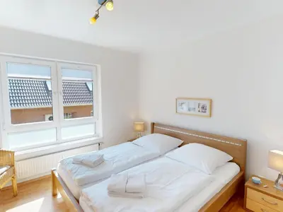 Ein Bett oder Betten in einem Zimmer der Unterkunft Strandburg - 6