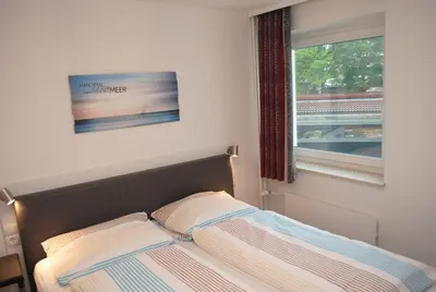 Ein Bett oder Betten in einem Zimmer der Unterkunft Hanseatic 101