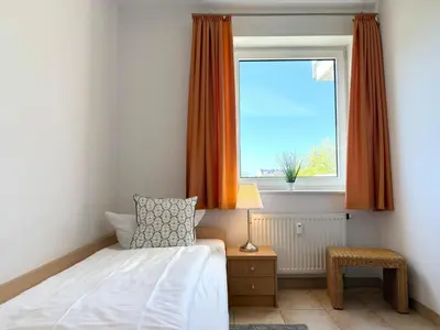 Ein Bett oder Betten in einem Zimmer der Unterkunft Haus am Waldbad Whg 1